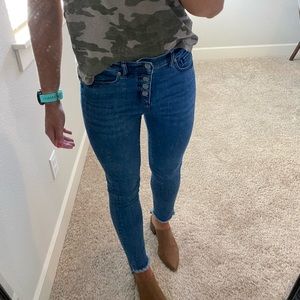 High waist button fly, step hem denim